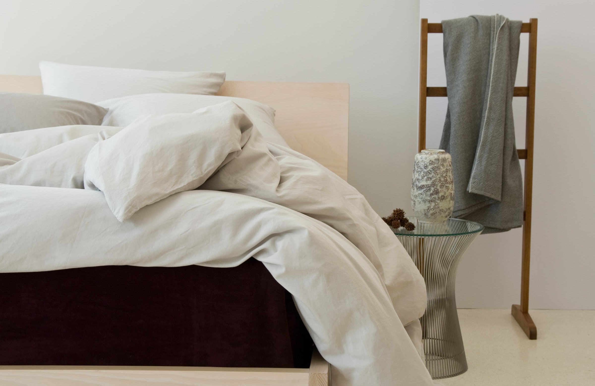 Natural luxury sheets and bedding on mattress