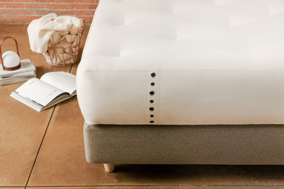 Natural Mattress made from spring, cotton, and wool on padded base platform bed