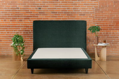 Padded Bed Base upholstered in custom fabric with square black legs and a matching headboard