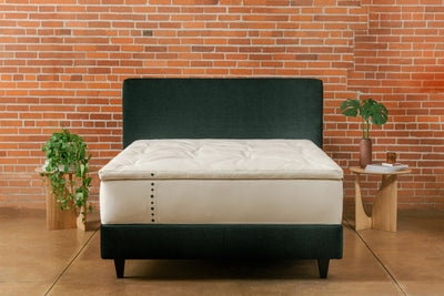 Wool topper on natural hybrid mattress and platform bed frame