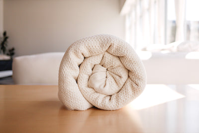 Rolled up organic cotton waffle blanket